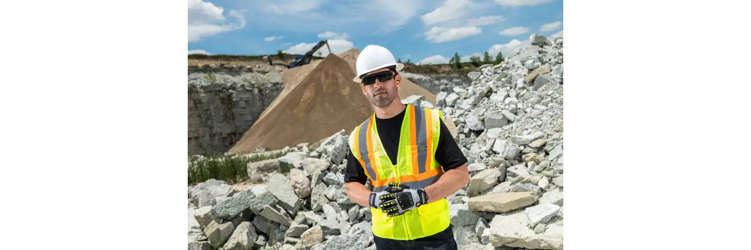 man wearing safety vest on construction site